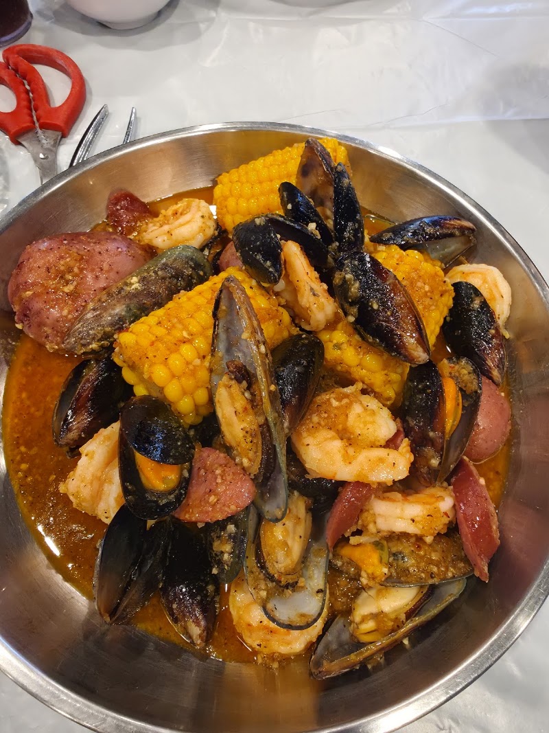 Food and interior photo 2 at Seafood Bucket Cajun Style Seafood Restaurant in South Salt Lake